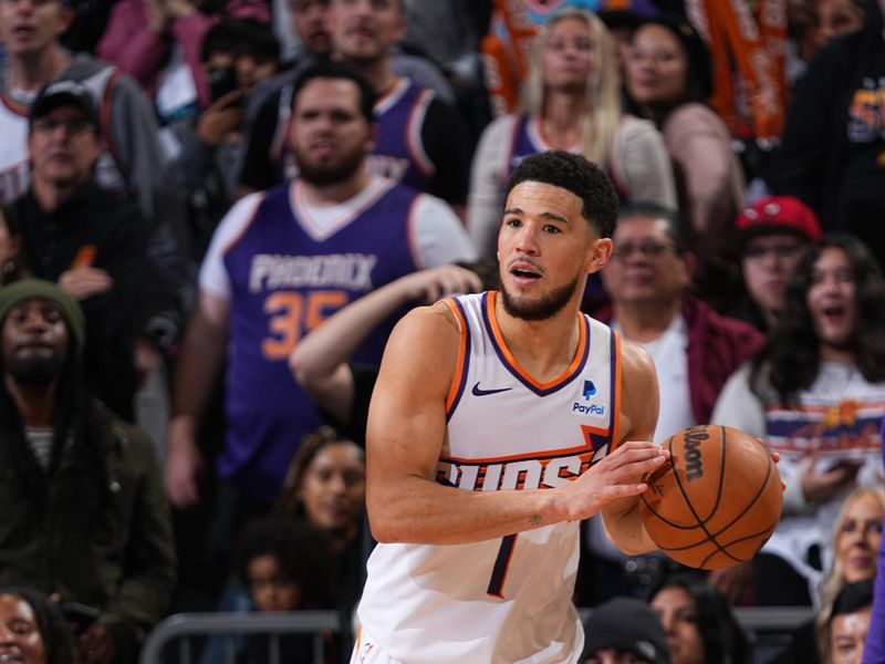 PHOENIX, AZ - JANUARY 22: Devin Booker #1 of the Phoenix Suns passes the ball during the game against the Chicago Bulls on January 22, 2024 at Footprint Center in Phoenix, Arizona. NOTE TO USER: User expressly acknowledges and agrees that, by downloading and or using this photograph, user is consenting to the terms and conditions of the Getty Images License Agreement. Mandatory Copyright Notice: Copyright 2024 NBAE (Photo by Garrett Ellwood/NBAE via Getty Images)