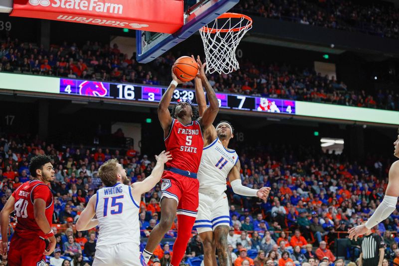 Feb 17, 2024; Boise, Idaho, USA; Fresno State Bulldogs guard Jalen Weaver (5) drives to the basket during the first half against the Boise State Broncos at ExtraMile Arena. Mandatory Credit: Brian Losness-USA TODAY Sports
