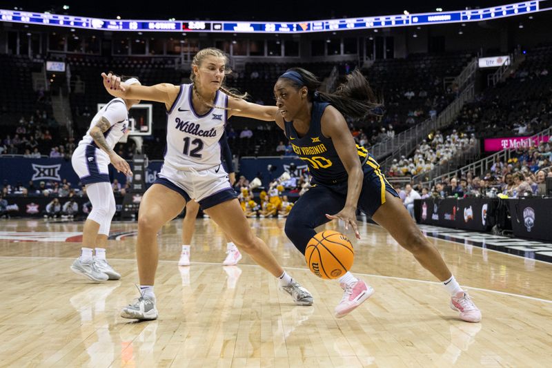 Mar 9, 2024; Kansas City, MO, USA; West Virginia Mountaineers guard Jayla Hemingway (00) handles the ball while defended by Kansas State Wildcats guard Gabby Gregory (12) during the first half at T-Mobile Center. Mandatory Credit: Amy Kontras-USA TODAY Sports