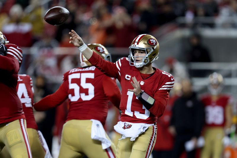 San Francisco 49ers quarterback Brock Purdy (13) throws a pass during an NFL football NFC divisional playoff game against the Green Bay Packers, Saturday, Jan. 20, 2024, in Santa Clara, Calif. (AP Photo/Jed Jacobsohn)