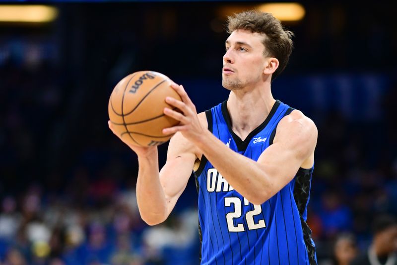 ORLANDO, FLORIDA - FEBRUARY 27: Franz Wagner #22 of the Orlando Magic looks to shoot a three-point shot the first half of a game against the Brooklyn Nets at Kia Center on February 27, 2024 in Orlando, Florida. NOTE TO USER: User expressly acknowledges and agrees that, by downloading and or using this photograph, User is consenting to the terms and conditions of the Getty Images License Agreement. (Photo by Julio Aguilar/Getty Images)