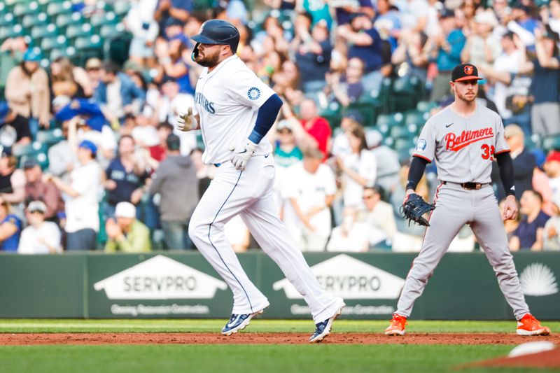 Jun 3, 2025; Seattle, Washington, USA; Seattle Mariners first baseman Rowdy Tellez (23) runs the bases after hitting a solo-home run against the Baltimore Orioles during the second inning at T-Mobile Park. Mandatory Credit: Joe Nicholson-Imagn Images