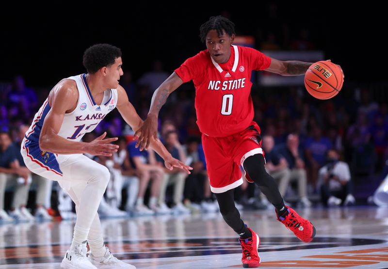 Nov 23, 2022; Paradise Island, BAHAMAS; North Carolina State Wolfpack guard Terquavion Smith (0) dribbles as Kansas Jayhawks guard Kevin McCullar Jr. (15) defends during the second half at Imperial Arena. Mandatory Credit: Kevin Jairaj-USA TODAY Sports