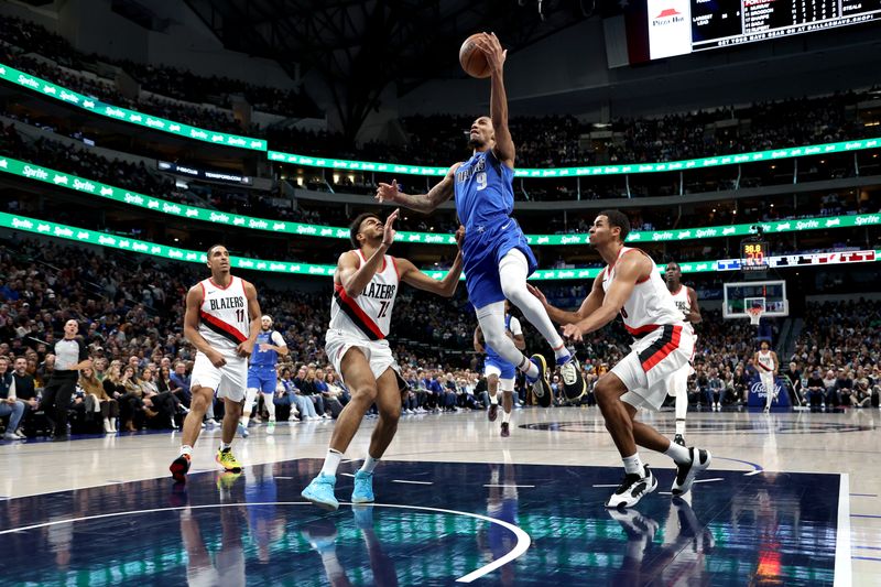 DALLAS, TEXAS - JANUARY 05: A.J. Lawson #9 of the Dallas Mavericks drives to the basket against the Portland Trail Blazers at American Airlines Center on January 05, 2024 in Dallas, Texas. NOTE TO USER: User expressly acknowledges and agrees that, by downloading and or using this photograph, User is consenting to the terms and conditions of the Getty Images License Agreement. (Photo by Tim Heitman/Getty Images)