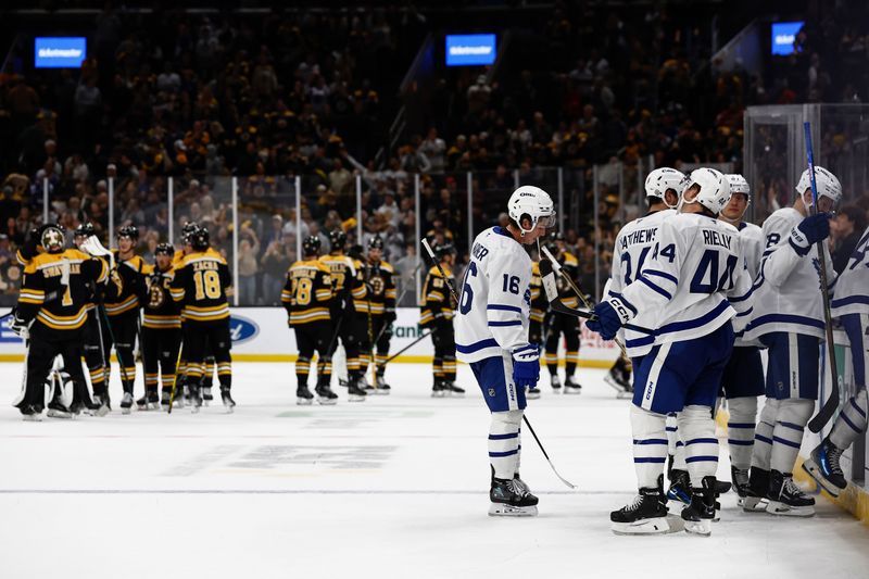 Oct 26, 2024; Boston, Massachusetts, USA; Toronto Maple Leafs right wing Mitch Marner (16) and teammates head for the dressing room as the Boston Bruins congratulate each other after their 4-3 overtime win at TD Garden. Mandatory Credit: Winslow Townson-Imagn Images