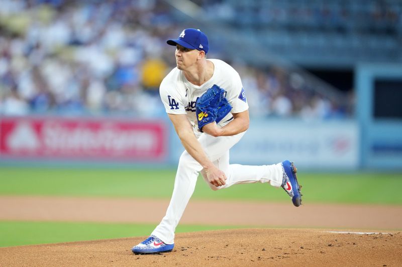 Aug 20, 2024; Los Angeles, California, USA; Los Angeles Dodgers starting pitcher Walker Buehler (21) throws in the first inning against the Seattle Mariners at Dodger Stadium. Mandatory Credit: Kirby Lee-USA TODAY Sports