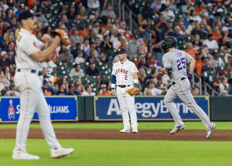 Jul 5, 2023; Houston, Texas, USA; Colorado Rockies designated hitter C.J. Cron (25) rounds the bases after hitting a home run against Houston Astros starting pitcher J.P. France (left) in the sixth inning at Minute Maid Park. Mandatory Credit: Thomas Shea-USA TODAY Sports