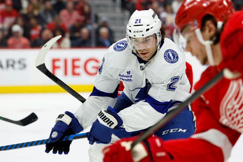 Jan 25, 2025; Detroit, Michigan, USA;  Tampa Bay Lightning center Brayden Point (21) goes after the puck in the third period against the Detroit Red Wings at Little Caesars Arena. Mandatory Credit: Rick Osentoski-Imagn Images