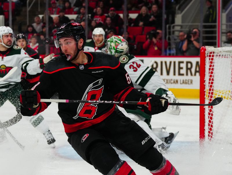 Jan 21, 2024; Raleigh, North Carolina, USA;  Carolina Hurricanes left wing Michael Bunting (58) misses on his shot attempt against the Minnesota Wild during the first period at PNC Arena. Mandatory Credit: James Guillory-USA TODAY Sports