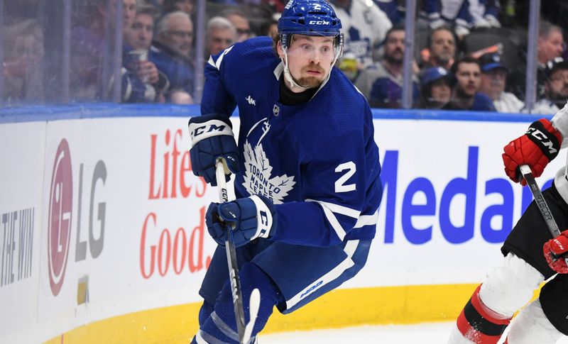 Apr 11, 2024; Toronto, Ontario, CAN; Toronto Maple Leafs defenseman Simon Benoit (2) pursues the play against the New Jersey Devils in the second period at Scotiabank Arena. Mandatory Credit: Dan Hamilton-USA TODAY Sports