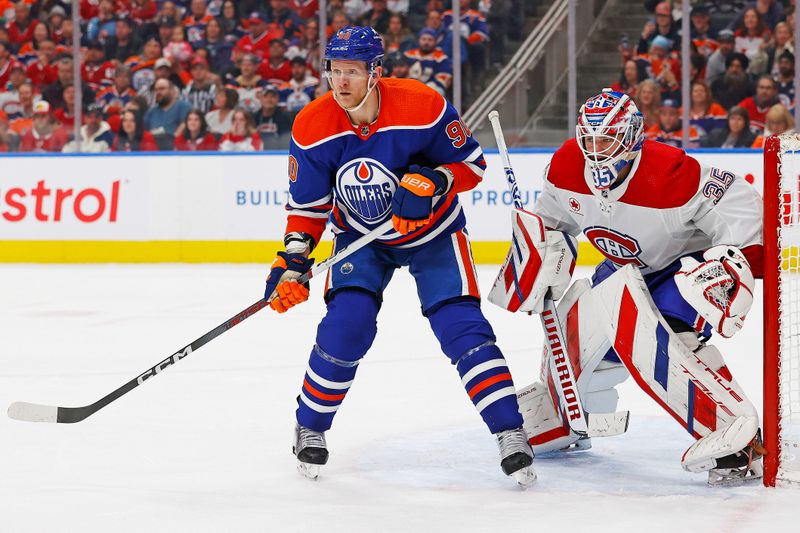 Mar 19, 2024; Edmonton, Alberta, CAN; Edmonton Oilers forward Corey Perry (90) looks for a pass ins front of Montreal Canadiens goaltender Sam Montembeault (35) during the third period at Rogers Place. Mandatory Credit: Perry Nelson-USA TODAY Sports