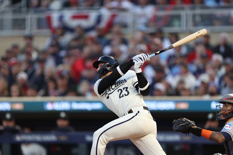 Oct 11, 2023; Minneapolis, Minnesota, USA; Minnesota Twins third baseman Royce Lewis (23) hits a solo home-run in the first inning against the Houston Astros  during game four of the ALDS for the 2023 MLB playoffs at Target Field. Mandatory Credit: Jesse Johnson-USA TODAY Sports