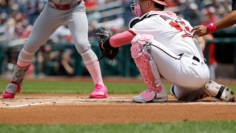 May 11, 2025; Washington, District of Columbia, USA; St. Louis Cardinals second base Brendan Donovan (33) bats as Washington Nationals catcher Riley Adams (15) catches while wearing Mother's Day colored gear during the first inning at Nationals Park. Mandatory Credit: Geoff Burke-Imagn Images