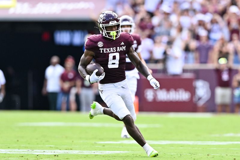 Sep 23, 2023; College Station, Texas, USA; Texas A&M Aggies running back Le'Veon Moss (8) runs the ball during the first half against the Auburn Tigers at Kyle Field. Mandatory Credit: Maria Lysaker-USA TODAY Sports