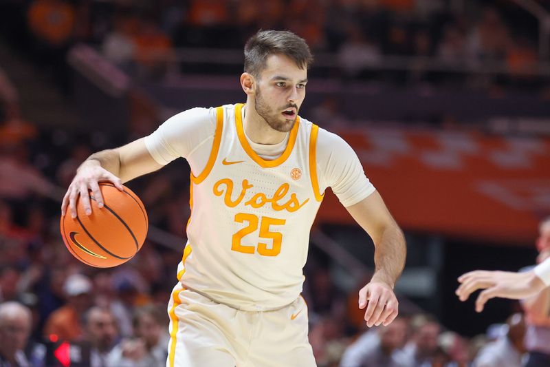 Feb 28, 2023; Knoxville, Tennessee, USA; Tennessee Volunteers guard Santiago Vescovi (25) brings the ball up court against the Arkansas Razorbacks during the second half at Thompson-Boling Arena. Mandatory Credit: Randy Sartin-USA TODAY Sports