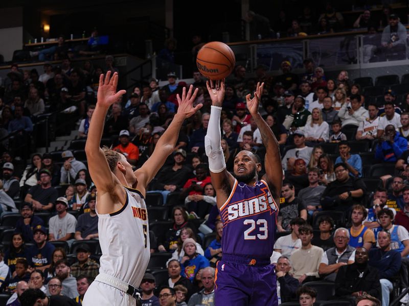 DENVER, CO - OCTOBER 13: Monte Morris #23 of the Phoenix Suns shoots a three point basket during the game against the Denver Nuggets on October 13, 2024 at Ball Arena in Denver, Colorado. NOTE TO USER: User expressly acknowledges and agrees that, by downloading and/or using this Photograph, user is consenting to the terms and conditions of the Getty Images License Agreement. Mandatory Copyright Notice: Copyright 2024 NBAE (Photo by Bart Young/NBAE via Getty Images)