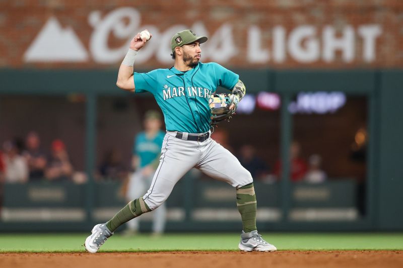 May 20, 2023; Atlanta, Georgia, USA; Seattle Mariners second baseman Jose Caballero (78) throws a runner out at first against the Atlanta Braves in the fifth inning at Truist Park. Mandatory Credit: Brett Davis-USA TODAY Sports