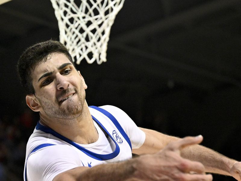 Feb 17, 2026; Dallas, Texas, USA; SMU Mustangs center Samet Yigitoglu (24) tries to keep the ball inbounds against the Louisville Cardinals during the second half at Moody Coliseum. Mandatory Credit: Jerome Miron-Imagn Images
