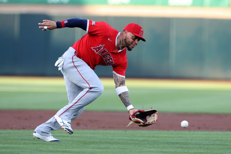 May 19, 2025; West Sacramento, California, USA; Los Angeles Angels third baseman Yoan Moncada (5) fields a ground ball during the first inning against the Athletics at Sutter Health Park. Mandatory Credit: Dennis Lee-Imagn Images