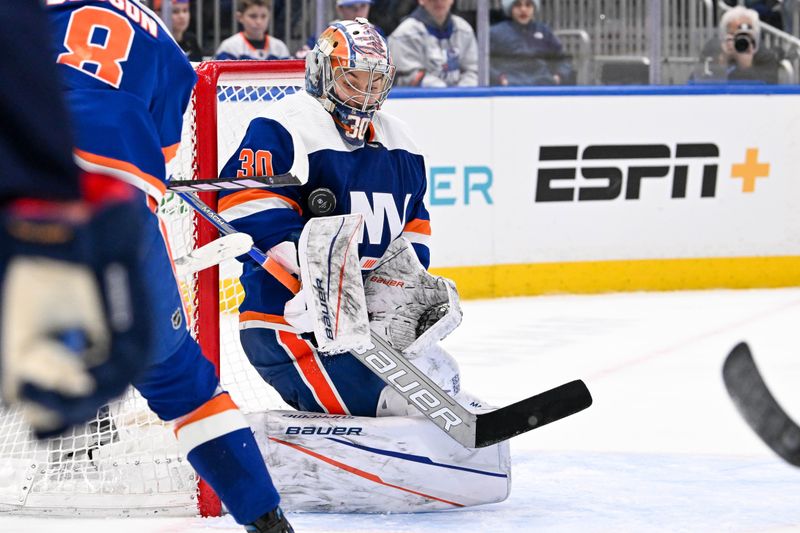 Mar 5, 2024; Elmont, New York, USA;  New York Islanders goaltender Ilya Sorokin (30) makes a save against the St. Louis Blues during the third period at UBS Arena. Mandatory Credit: Dennis Schneidler-USA TODAY Sports