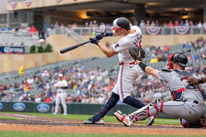 Jul 4, 2024; Minneapolis, Minnesota, USA; Minnesota Twins outfielder Max Kepler (26) singles in the second inning against Detroit Tigers starting pitcher Kenta Maeda (18) at Target Field. Mandatory Credit: Matt Blewett-USA TODAY Sports