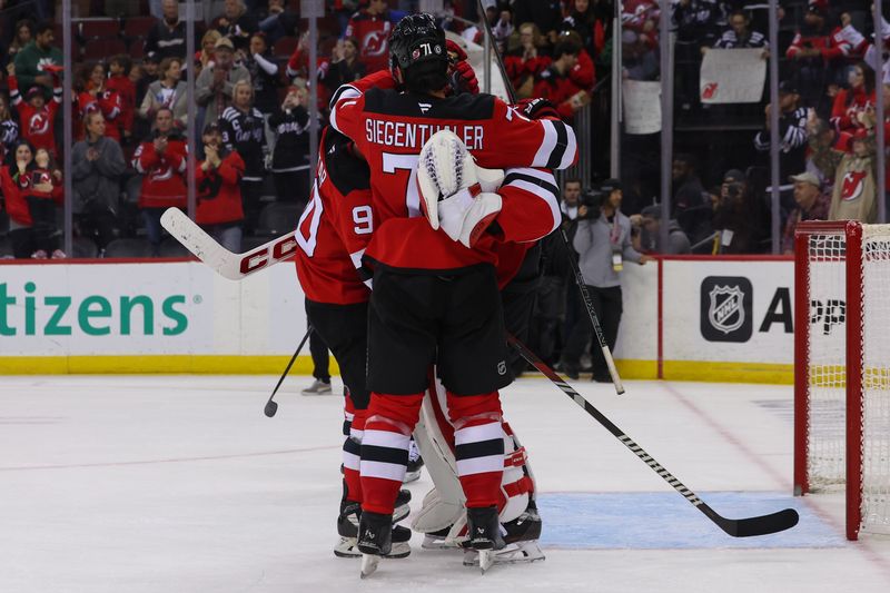 Oct 27, 2024; Newark, New Jersey, USA; The New Jersey Devils celebrate their win over the against the Anaheim Ducks at Prudential Center. Mandatory Credit: Ed Mulholland-Imagn Images