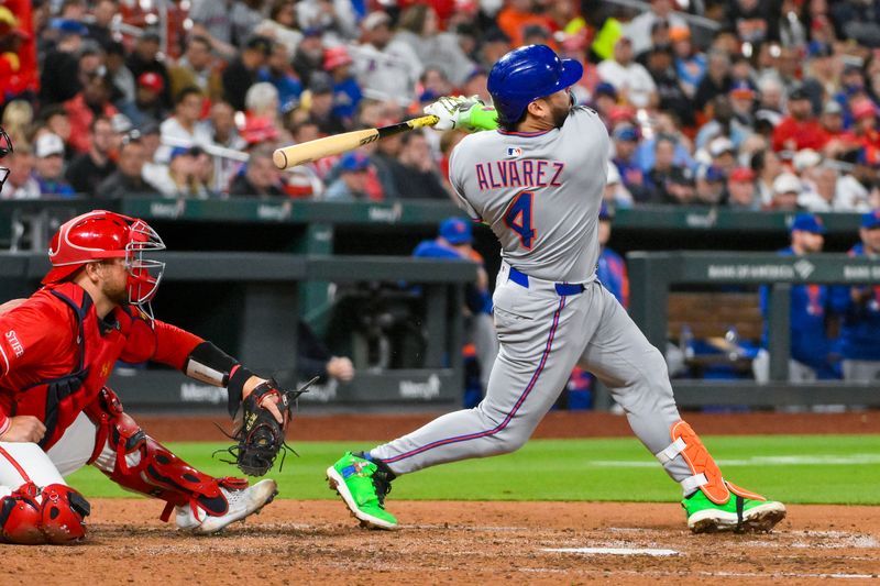 May 2, 2025; St. Louis, Missouri, USA;  New York Mets catcher Francisco Alvarez (4) hits a one run single against the St. Louis Cardinals during the fifth inning at Busch Stadium. Mandatory Credit: Jeff Curry-Imagn Images