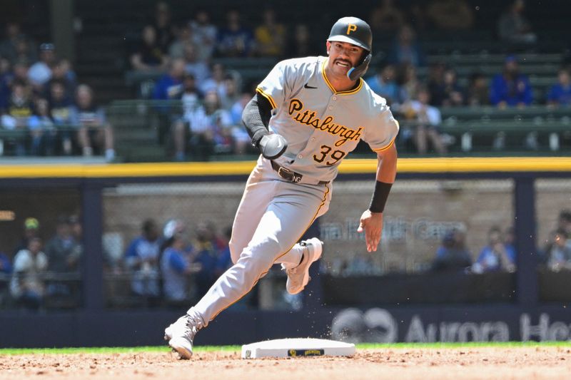 May 15, 2024; Milwaukee, Wisconsin, USA; Pittsburgh Pirates second baseman Nick Gonzales (39) runs to third base after a hit in the second inning against the Milwaukee Brewers at American Family Field. Mandatory Credit: Benny Sieu-USA TODAY Sports