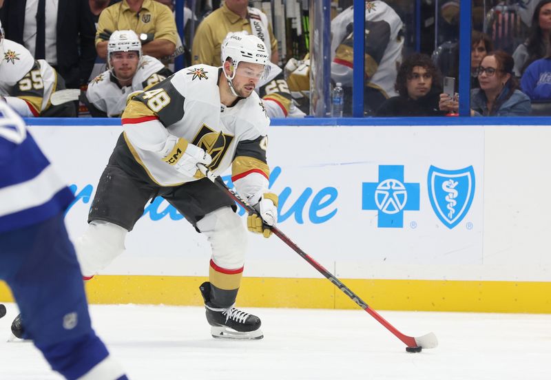 wOct 17, 2024; Tampa, Florida, USA; Vegas Golden Knights center Tomas Hertl (48) skates with the puck against the Tampa Bay Lightning during the second period at Amalie Arena. Mandatory Credit: Kim Klement Neitzel-Imagn Images