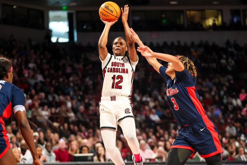 Feb 4, 2024; Columbia, South Carolina, USA; South Carolina Gamecocks guard MiLaysia Fulwiley (12) shoots over Ole Miss Rebels guard Kennedy Todd-Williams (3) in the first half at Colonial Life Arena. Mandatory Credit: Jeff Blake-USA TODAY Sports