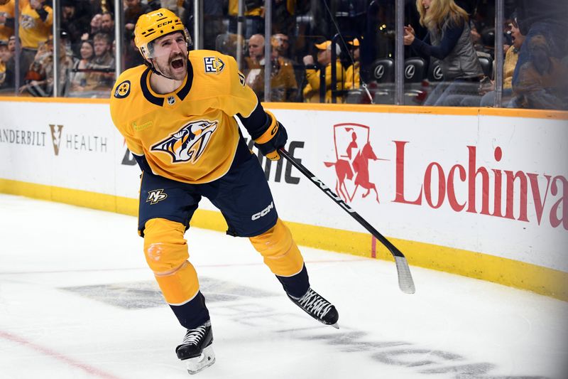 Jan 31, 2024; Nashville, Tennessee, USA; Nashville Predators left wing Filip Forsberg (9) celebrates after a goal during the third period against the Los Angeles Kings at Bridgestone Arena. Mandatory Credit: Christopher Hanewinckel-USA TODAY Sports