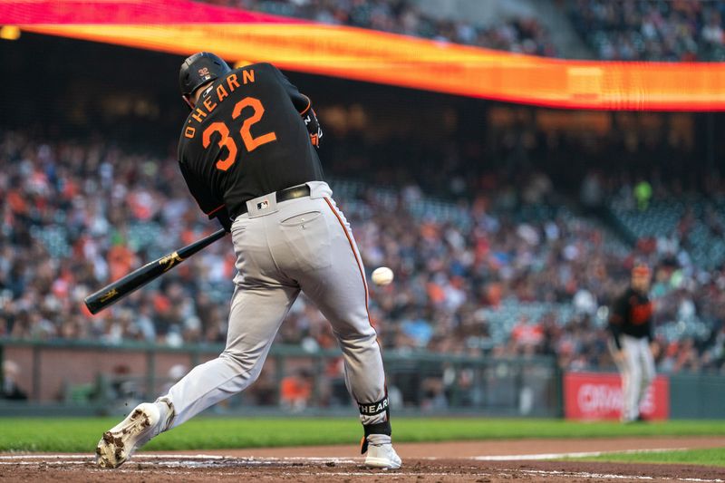 Jun 2, 2023; San Francisco, California, USA;  Baltimore Orioles first baseman Ryan O'Hearn (32) hits a RBI single during the second inning against the San Francisco Giants at Oracle Park. Mandatory Credit: Neville E. Guard-USA TODAY Sports