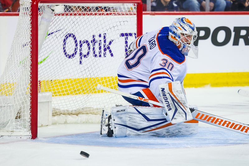 Apr 6, 2024; Calgary, Alberta, CAN; Edmonton Oilers goaltender Calvin Pickard (30) guards his net against the Calgary Flames during the second period at Scotiabank Saddledome. Mandatory Credit: Sergei Belski-USA TODAY Sports