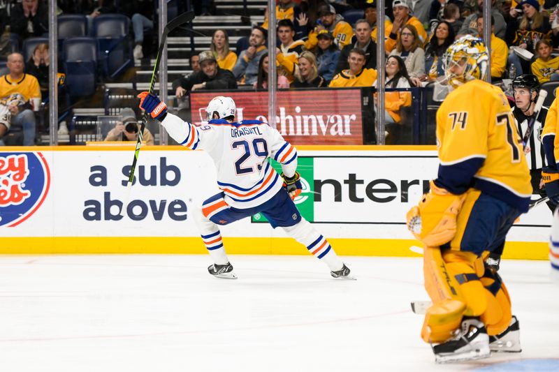 Oct 31, 2024; Nashville, Tennessee, USA;  Edmonton Oilers center Leon Draisaitl (29) celebrates his goal against the Nashville Predators during the second period at Bridgestone Arena. Mandatory Credit: Steve Roberts-Imagn Images