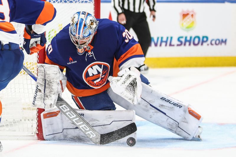 Jan 16, 2025; Elmont, New York, USA;  New York Islanders goaltender Ilya Sorokin (30) makes a save on a shot on goal attempt in the third period against the Philadelphia Flyers at UBS Arena. Mandatory Credit: Wendell Cruz-Imagn Images