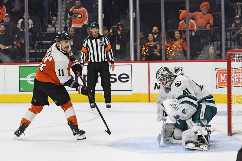 Nov 11, 2024; Philadelphia, Pennsylvania, USA; Philadelphia Flyers right wing Travis Konecny (11) scores the game-winning goal against San Jose Sharks goaltender Vitek Vanecek (41) during the shootout period at Wells Fargo Center. Mandatory Credit: Eric Hartline-Imagn Images