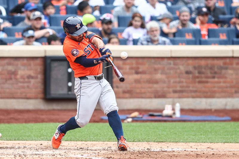 Jun 30, 2024; New York City, New York, USA;  Houston Astros second baseman Jose Altuve (27) hits an RBI single in the fifth inning against the New York Mets at Citi Field. Mandatory Credit: Wendell Cruz-USA TODAY Sports