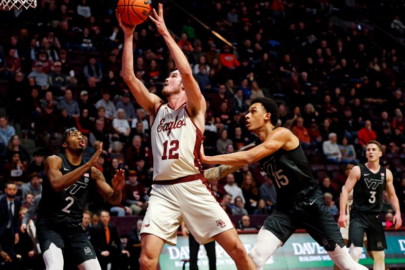 Jan 23, 2024; Blacksburg, Virginia, USA; Boston College Eagles forward Quinten Post (12) drives to the basket against Virginia Tech Hokies center Lynn Kidd (15) and guard MJ Collins (2) during the first half at Cassell Coliseum. Mandatory Credit: Peter Casey-USA TODAY Sports