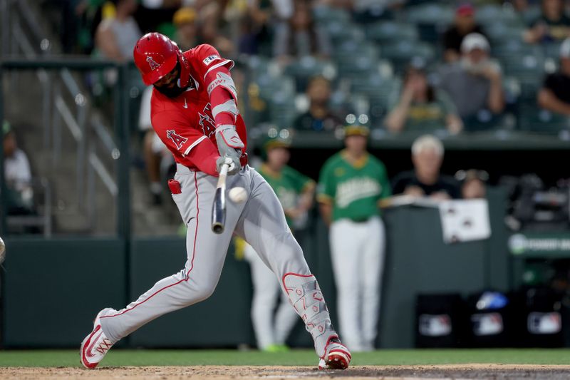 May 19, 2025; West Sacramento, California, USA; Los Angeles Angels right fielder Jo Adell (7) lines out to left field against the Athletics during the fourth inning at Sutter Health Park. Mandatory Credit: Dennis Lee-Imagn Images