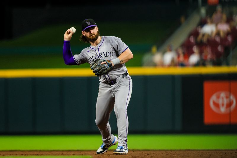 Jul 9, 2024; Cincinnati, Ohio, USA; Colorado Rockies second baseman Brendan Rodgers (7) throws to first to get Cincinnati Reds outfielder Will Benson (not pictured) out in the sixth inning at Great American Ball Park. Mandatory Credit: Katie Stratman-USA TODAY Sports