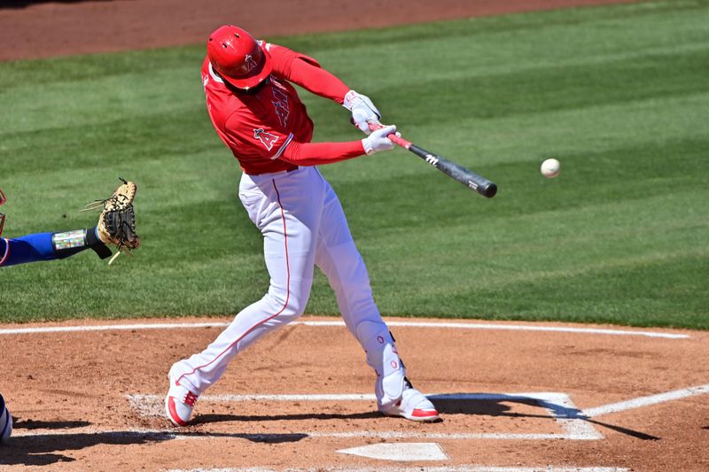 Mar 11, 2024; Tempe, Arizona, USA;  Los Angeles Angels right fielder Jo Adell (7) doubles in the second inning against the Texas Rangers during a spring training game at Tempe Diablo Stadium. Mandatory Credit: Matt Kartozian-USA TODAY Sports