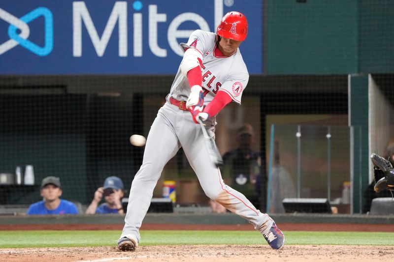 Apr 14, 2022; Arlington, Texas, USA; Los Angeles Angels designated hitter Shohei Ohtani (17) swings for a double against the Texas Rangers during the ninth inning of a baseball game at Globe Life Field. Mandatory Credit: Jim Cowsert-USA TODAY Sports