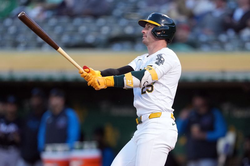 May 3, 2024; Oakland, California, USA; Oakland Athletics designated hitter Brent Rooker (25) watches the flight of his home run against the Miami Marlins during the fourth inning at Oakland-Alameda County Coliseum. Mandatory Credit: Darren Yamashita-USA TODAY Sports