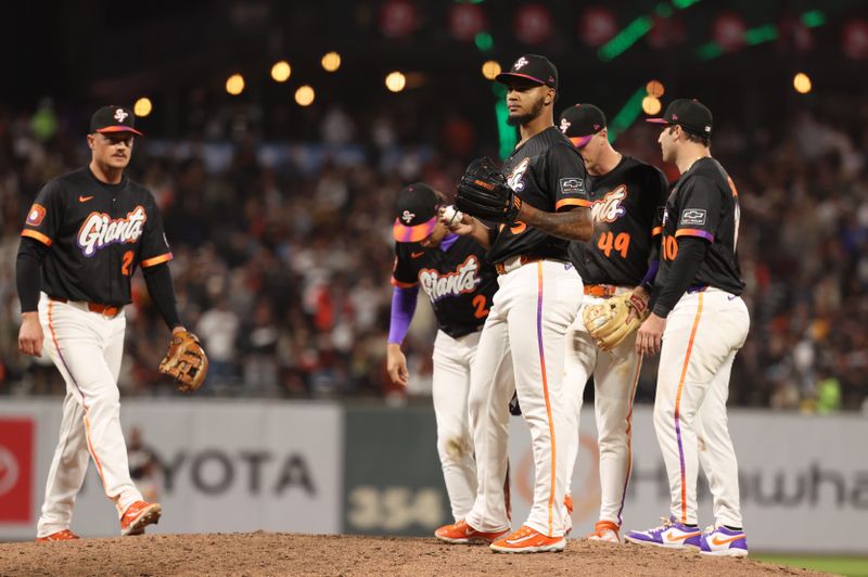 Jun 3, 2025; San Francisco, California, USA;  Players visit San Francisco Giants relief pitcher Camilo Doval (75) on the mound during the ninth inning against the San Diego Padres at Oracle Park. Mandatory Credit: Kelley L Cox-Imagn Images