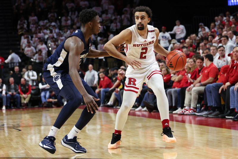 Jan 31, 2024; Piscataway, New Jersey, USA; Rutgers Scarlet Knights guard Noah Fernandes (2) dribbles against Penn State Nittany Lions guard D'Marco Dunn (2) during the second half at Jersey Mike's Arena. Mandatory Credit: Vincent Carchietta-USA TODAY Sports