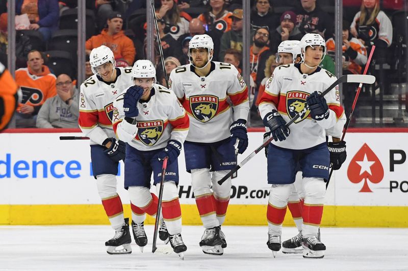 Dec 5, 2024; Philadelphia, Pennsylvania, USA; Florida Panthers center Evan Rodrigues (17) celebrates his goal with teammates against the Philadelphia Flyers during the first period at Wells Fargo Center. Mandatory Credit: Eric Hartline-Imagn Images