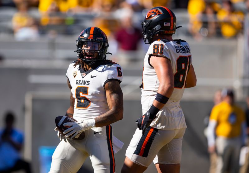 Nov 19, 2022; Tempe, Arizona, USA; Oregon State Beavers running back Damien Martinez (6) celebrates a touchdown with tight end Jake Overman (81) against the Arizona State Sun Devils during the first half at Sun Devil Stadium. Mandatory Credit: Mark J. Rebilas-USA TODAY Sports