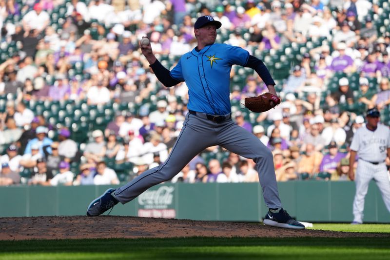 Apr 5, 2024; Denver, Colorado, USA; Tampa Bay Rays pitcher Pete Fairbanks (29) delivers a pitch in the ninth inning against the Colorado Rockies at Coors Field. Mandatory Credit: Ron Chenoy-USA TODAY Sports