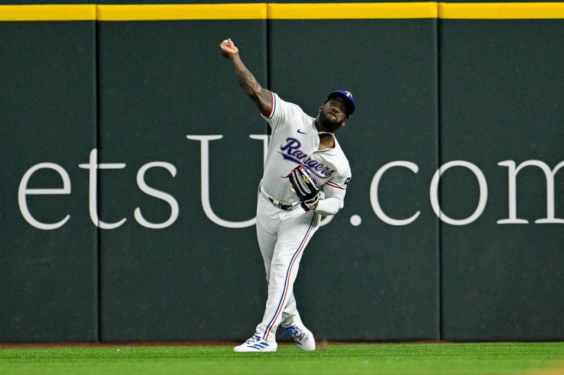 Jun 8, 2024; Arlington, Texas, USA; Texas Rangers right fielder Adolis Garcia (53) throws the ball in during the first inning against the Texas Rangers at Globe Life Field. Mandatory Credit: Jerome Miron-USA TODAY Sports