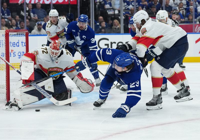 May 7, 2025; Toronto, Ontario, CAN; Toronto Maple Leafs left wing Matthew Knies (23) battles for the puck in front of Florida Panthers goaltender Sergei Bobrovsky (72) during the first period in game two of the second round of the 2025 Stanley Cup Playoffs at Scotiabank Arena. Mandatory Credit: Nick Turchiaro-Imagn Images